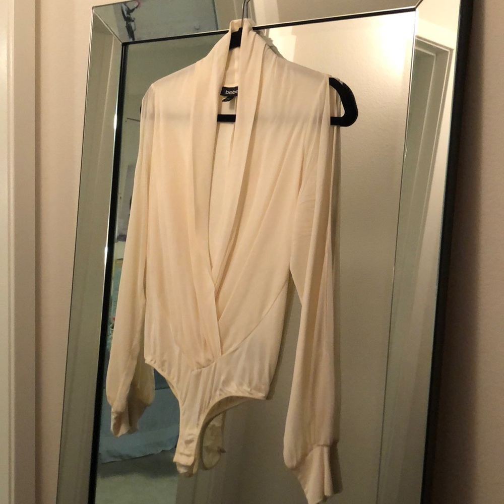 Beautiful Bebe NEVER worn ivory bodysuit